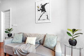 Cozy and welcoming living area with ample seating and a warm, homey atmospher