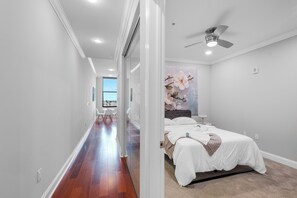 Spacious bedroom with a Queen-sized bed and contemporary design, offering ultimate comfort