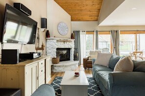The living area provides a wood burning fireplace and a wall HVAC split unit