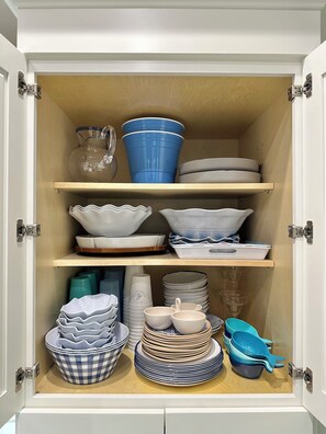 Plenty of melamine dishes and serving pieces for enjoying outdoors