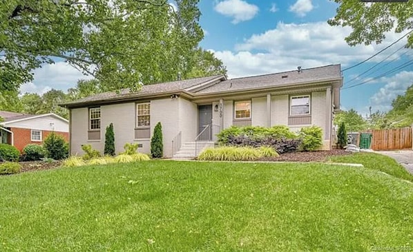 1-level bungalow with a beautiful set back and private fenced back yard