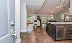 Open Concept A-frame. Living Room, Kitchen, dining area with views of the yard