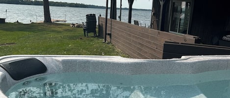 Soak your worries away in the lake side hot tub