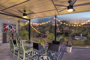covered patio with TV, game