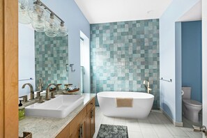 The luxurious soaking tub is perfect for unwinding after a long day. 