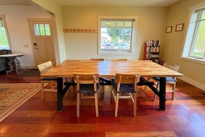 Gather around the dining table for food, conversation, or fun.