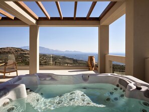 An outdoor four seater jacuzzi is located at the first floor balcony.