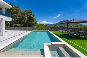 The villa has a heated pool with a fully automated salt electrolysis system