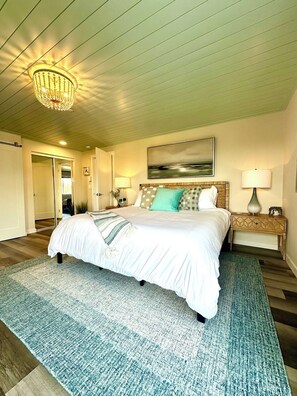 En suite king bedroom with smart TV and deck to sit and watch the canal.