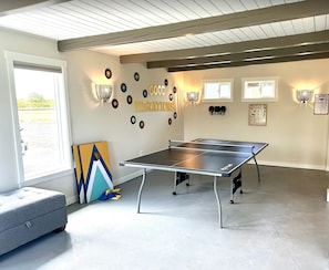 Private game room with Ping Pong, Darts, Giant Connect 4, Pitch N Putt, and Corn Hole. 