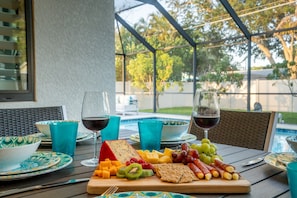 "Wine" down after a long day at the beach around the outdoor dining table