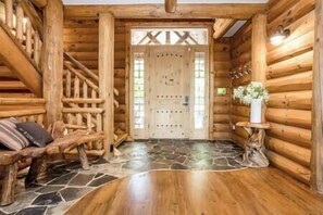 Step inside to beautiful stone and hardwood floors in an open concept living space.