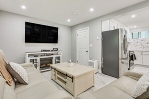 Living Room | 1st Floor | 65" Smart TV | Video Games | Electric Fireplace