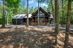 This cabin surrounded by towering pines!