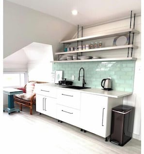 Kitchen is fully equipped to cook in.