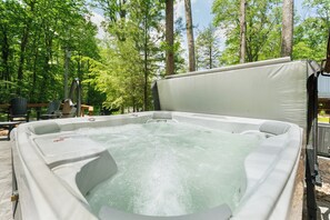 You will love having your own private hot tub along with the outdoor dining area and fire pit.
