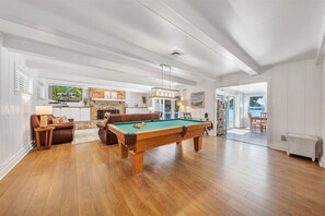 Enjoy a game of pool right off the living room and kitchen!
