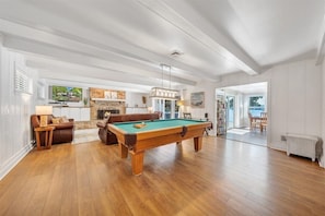 Enjoy a game of pool right off the living room and kitchen!