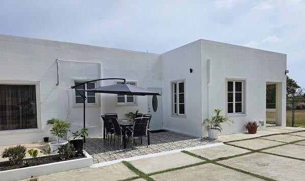 Exterior, front of condo with patio furniture, perfect for al fresco dining