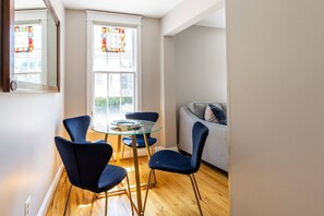 The sunny eat-in kitchen nook has seating for 4 at the table.