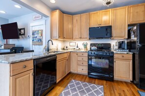 The full kitchen is located off the family room and is ready for your weekend dinner plans!