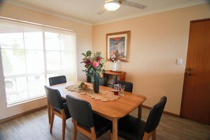 The dining space invites family meals, game nights or shared conversations with sea breeze ambiance.