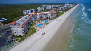 Aerial view of the Sandpiper Condominium with the best pool area along the beach!