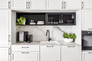 A fully equipped kitchen allows for comfortable long stays