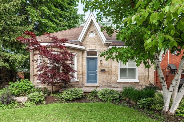 Stratford Charm: Our property's exterior echoes the architectural beauty of Stratford, Ontario. Steps from downtown and the Stratford Festival Theatres, it offers a picturesque start to your local adventure