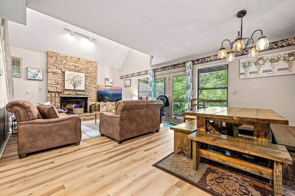The open floor plan includes the living room and dining table conveniently located nearby.