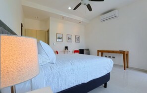 The room has A/C and a ceiling fan to keep you cool