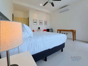 The room has A/C and a ceiling fan to keep you cool