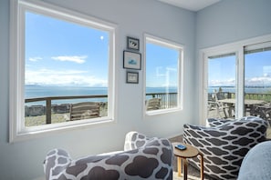 The West-facing living room cozy seating area with ocean views.