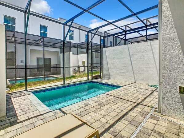 Enjoy the sun and relax by the fully fenced pool area, complete with comfortable sun loungers for your leisure.