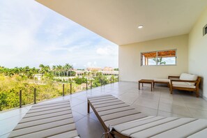 Relax and enjoy the view from the spacious balcony