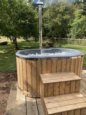 Relax and unwind in Cabin 2's hot tub