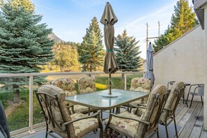 Private balcony with a BBQ, outdoor seating & mountain views