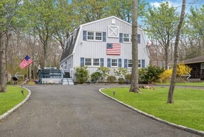 Barn style home with expansive wrap around deck