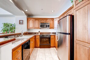 The 4 Bedroom Condo features a fully-equipped kitchen