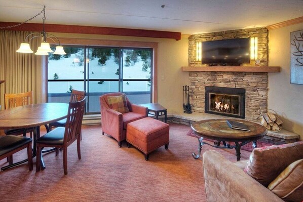 Warm up in front of the cozy wood-burning fireplace after a day on the slopes.