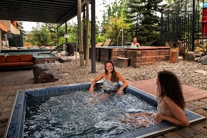 Take a dip in the shared outdoor hot tub!