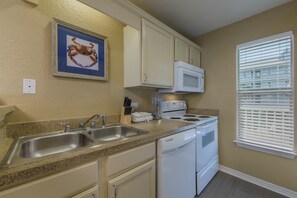 Prepare a meal in the equipped kitchen.