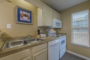 Prepare a meal in the equipped kitchen.