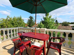 Sky, Table, Property, Furniture, Building, Umbrella, Cloud, Plant, Outdoor Table, Nature