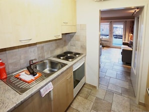Tap, Kitchen Sink, Sink, Cabinetry, Plumbing Fixture, Countertop, Kitchen Stove, Kitchen, Wood, Building
