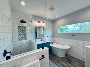 Spa-like master bath with soaking tub and walk-in shower with rainfall head