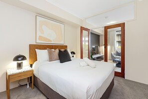 Retreat to the calming ambiance of the bedroom, boasting a luxurious queen-sized bed with high-quality linens and ample closet space for your belongings.