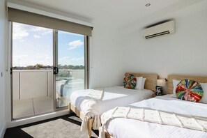 2 Single Beds with balcony access and large wardrobe.