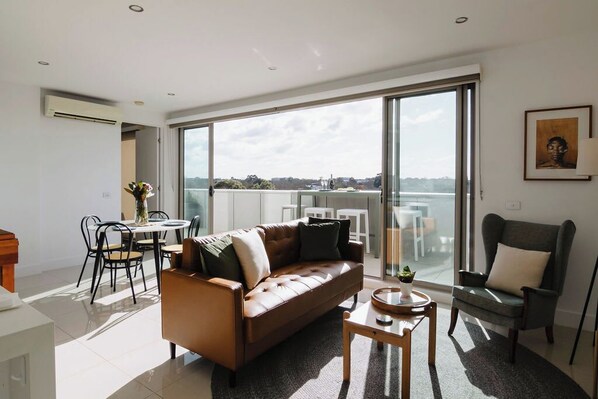 Our cosy living area invites you to relax and enjoy your favorite shows on the sleek TV.