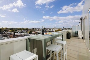 Unwind with a book or enjoy a morning coffee on your balcony oasis, complete with a cosy chair and table
